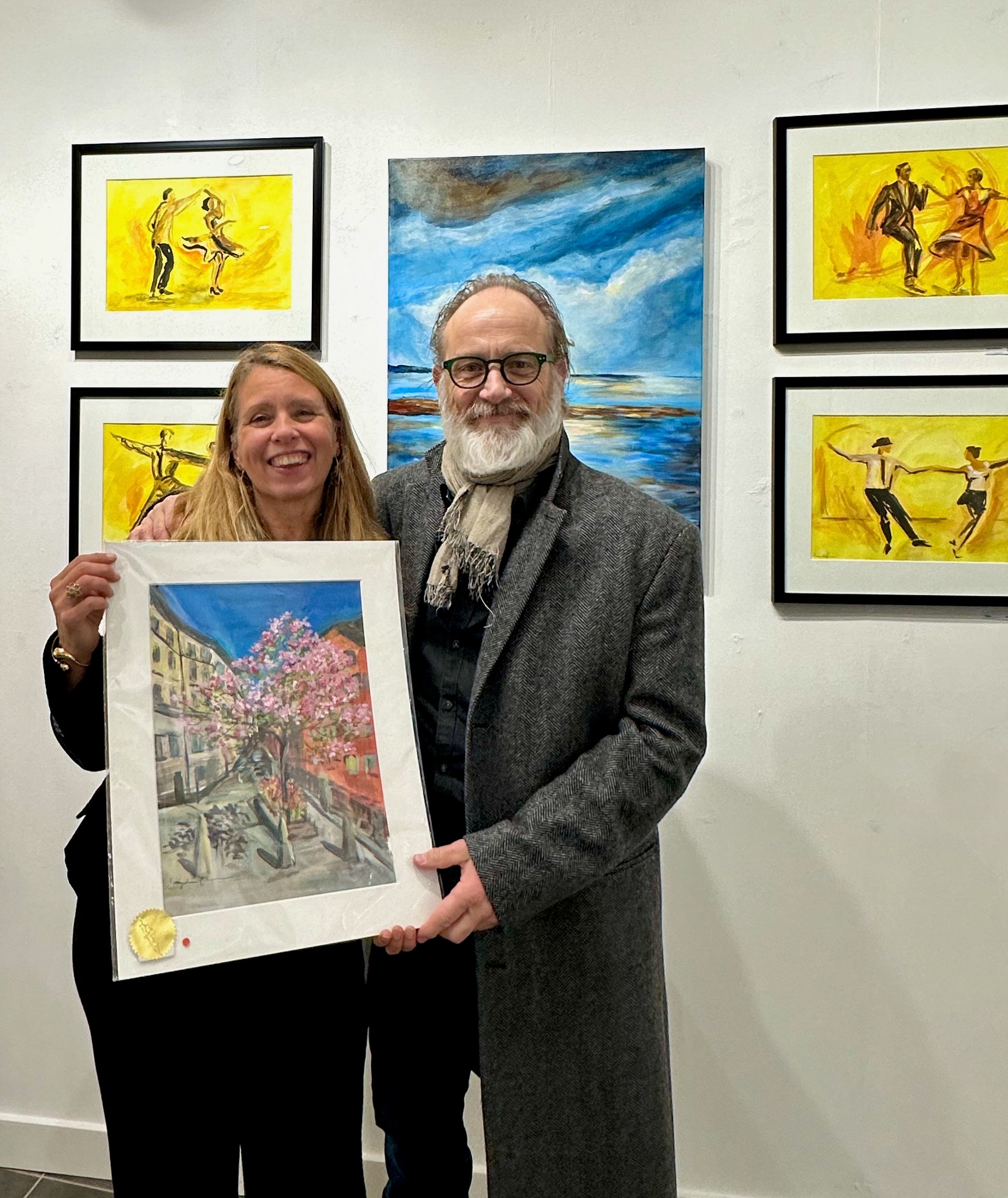 Actor Samuel Fröler and artist Ingela Johansson with "Magnolia and Tulips" artwork