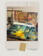 Artist Ingela Johansson painting an expressive acrylic work on paper in the studio using layered brushstrokes and intuitive movement.