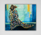 Expressive painting "Storm" by Ingela Johansson, showing a woman in a warm, colorful blanket against an abstract blue-toned backdrop. Limited edition print.
