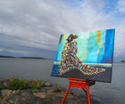 "Storm" acrylic painting by Swedish artist Ingela Johansson on an easel by the lake