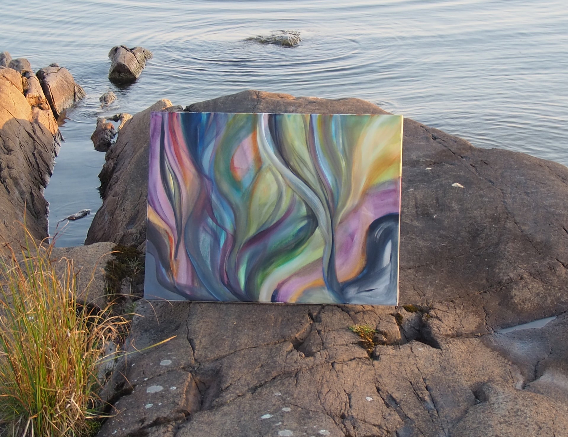 Artwork Sunset Currents on the cliffs that inspired the painting. By Ingela Johansson