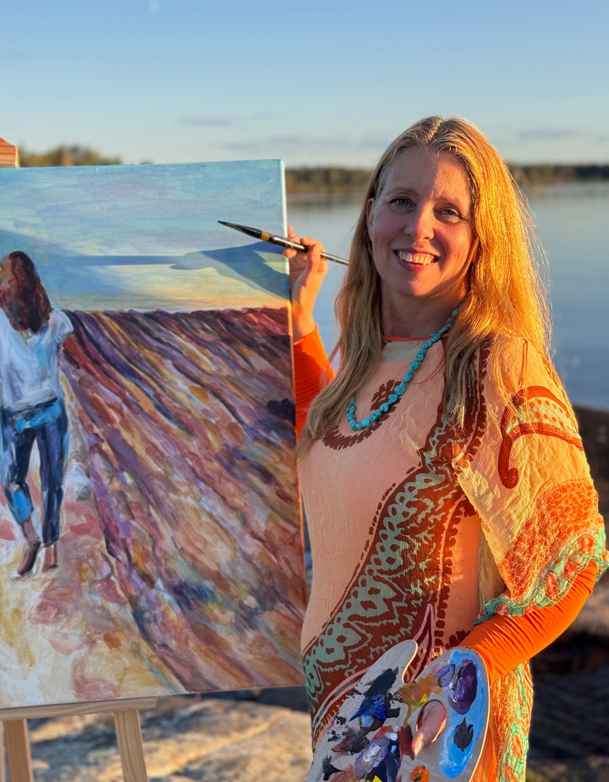 Swedish artist Ingela Johansson beside her painting Joie de Vivre, painted on a summer evening by Lake Vänern