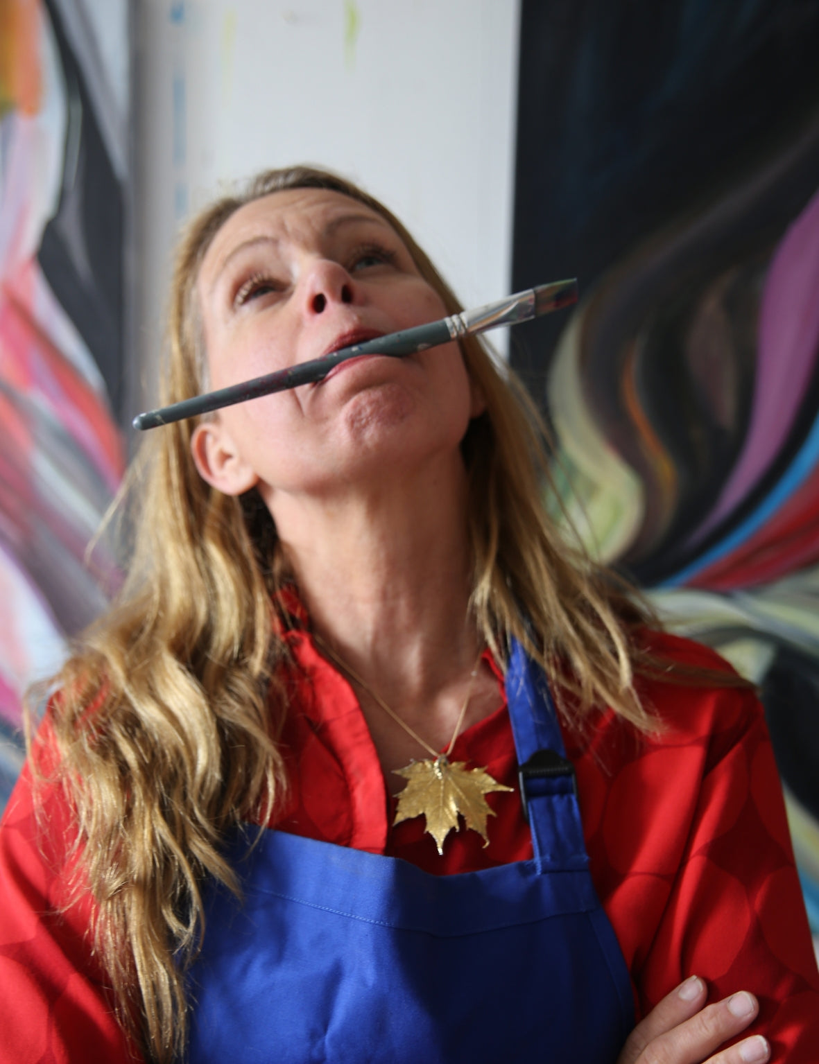 Artist Ingela Johansson in the studio painting the artwork Play