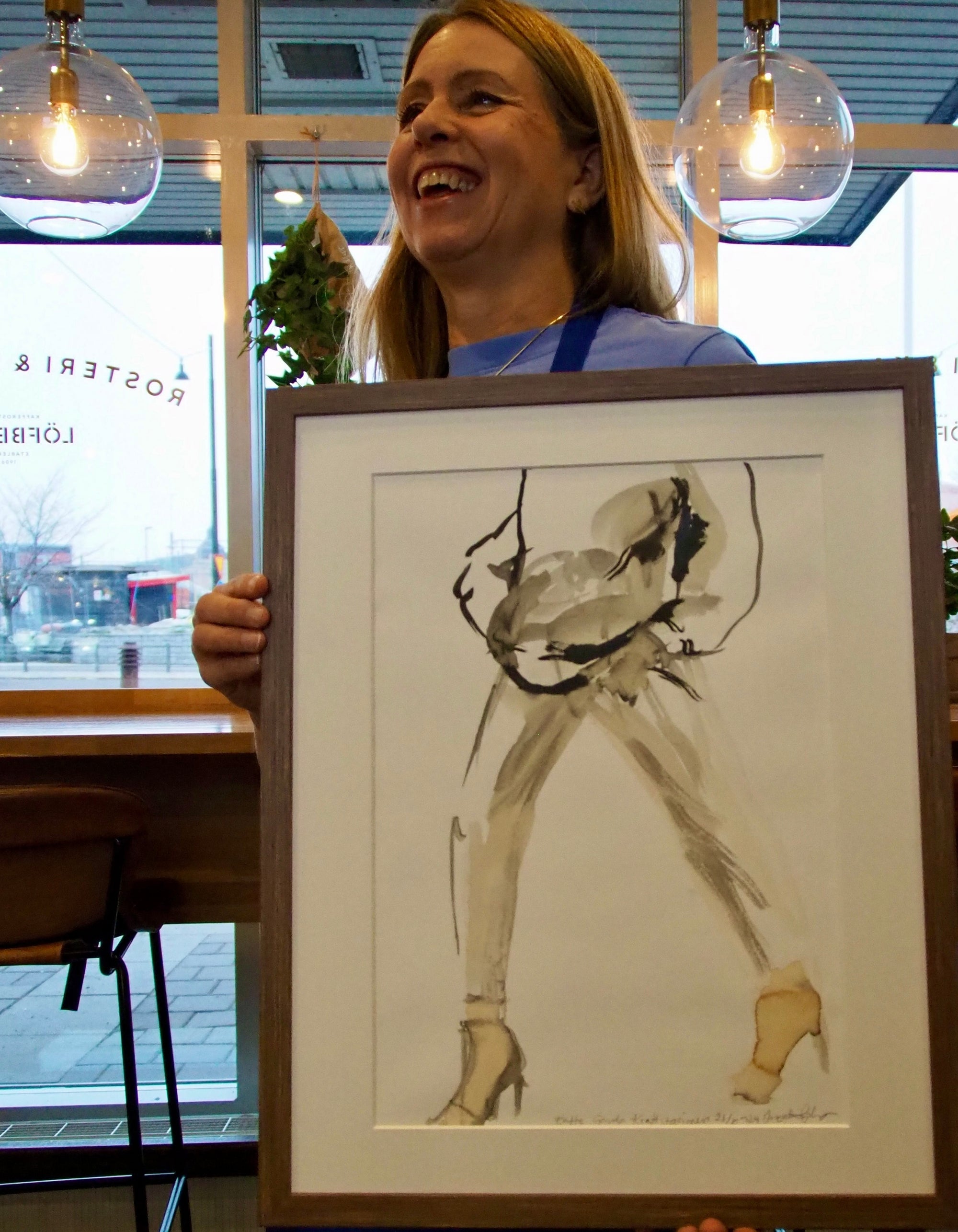 Artist Ingela Johansson with her coffee painting Coffee to Go