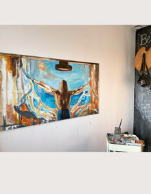 Behind-the-scenes photo of Swedish artist Ingela Johansson painting Open Up in her studio.