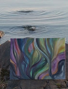 Video of artist Ingela Johansson painting Sunset Currents by the water, inspired by the shape of the rocks and moving water