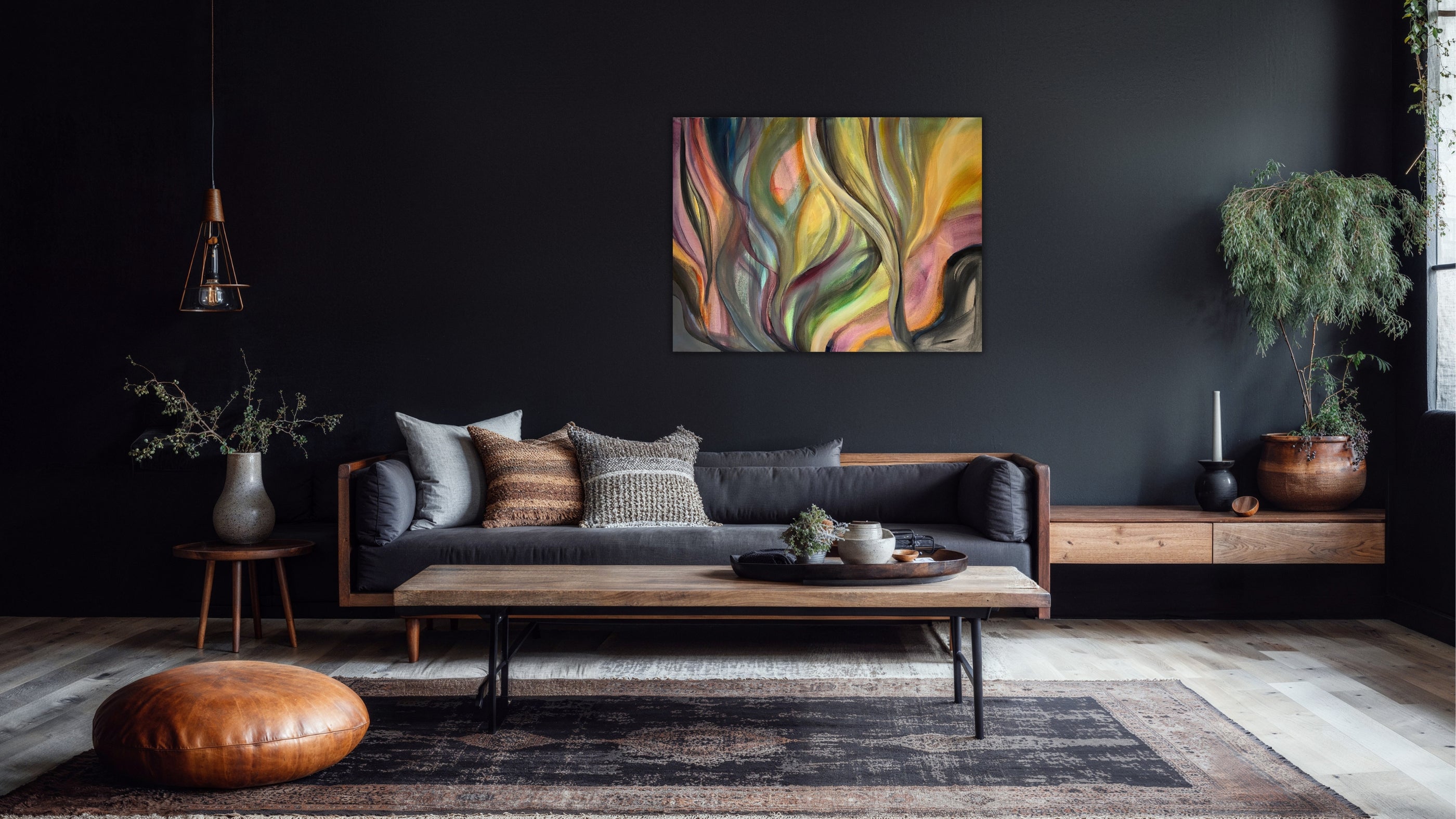 Soft abstract painting Sunset Currents from the Rhythms of Color collection by Swedish artist Ingela Johansson, displayed above a sofa on a dark wall